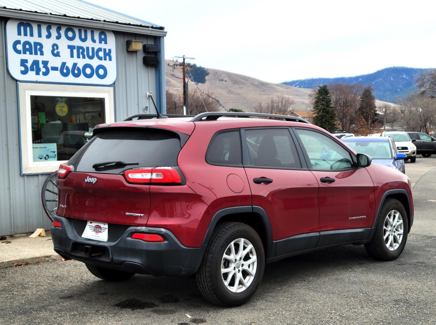 2016 Maroon /Tan Jeep Cherokee Sport (1C4PJMAB9GW) with an 2.4L I4 engine, 9 Speed Automatic transmission, located at 450 N Russell, Missoula, MT, 59801, (406) 543-6600, 46.874496, -114.017433 - Clean 4 Wheel Drive SUV. Air. Cruise. Tilt. Power Windows and Locks. Bluetooth. Backup Camera. - Photo#1